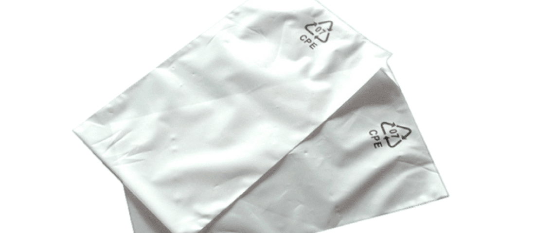 Two overlapping white rectangular plastic bags with a recycling symbol and the text CPE printed on them.
