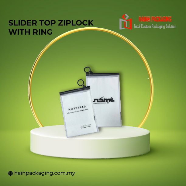 Two white translucent slider top ziplock bags with black rings displayed on a white circular pedestal against a green background.