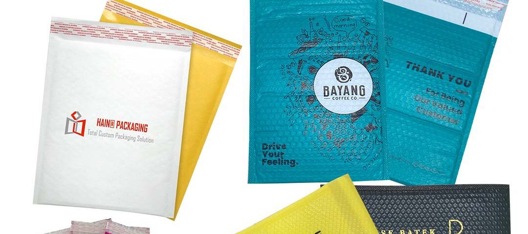 A collection of various bubble courier bags in different colors and designs, including white, yellow, teal, and black.