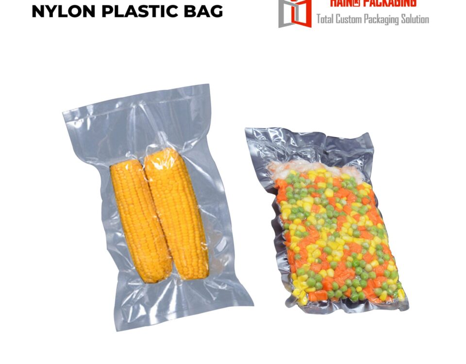 Two clear vacuum-sealed plastic bags, one containing two ears of corn and the other containing a mix of frozen vegetables.