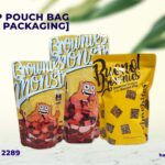 Three yellow stand-up pouches labeled Brownies and Bueno Brownies with cartoon monster graphics.