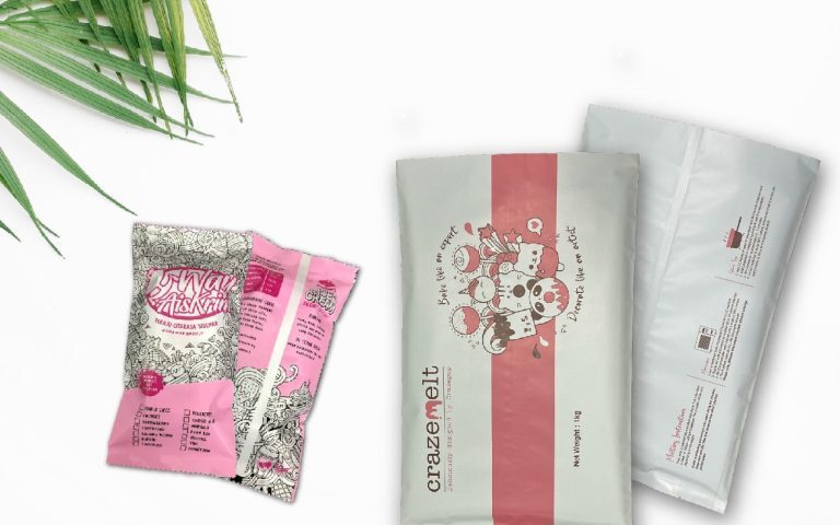 Two types of center seal packaging bags displayed on a white background with a palm leaf accent.